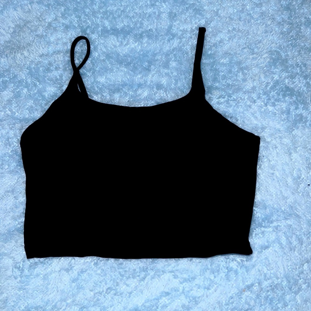Black crop tank top. This too is more on the silky side. It has have padding.